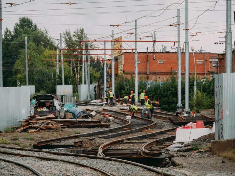 people working on train tracks
