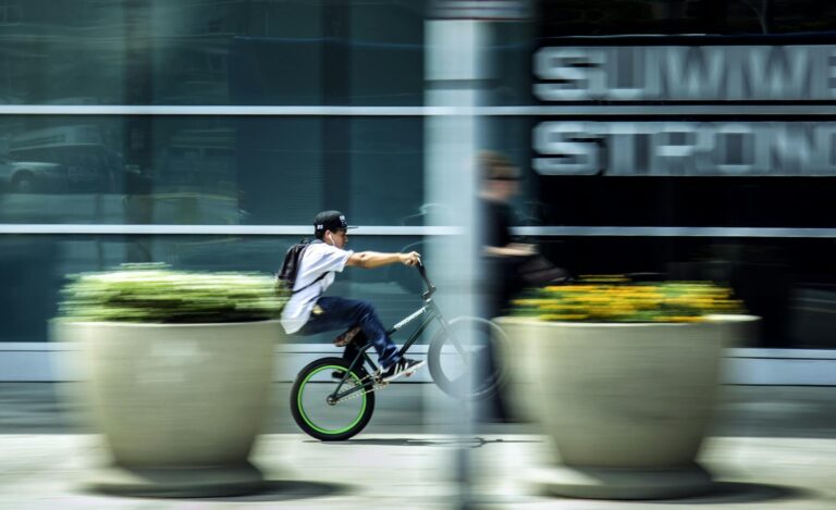 man riding bicycle in city