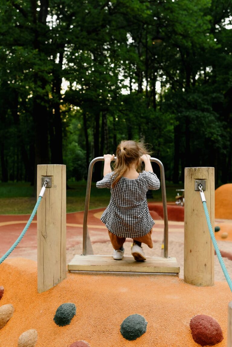 a child playing on outdoor playground