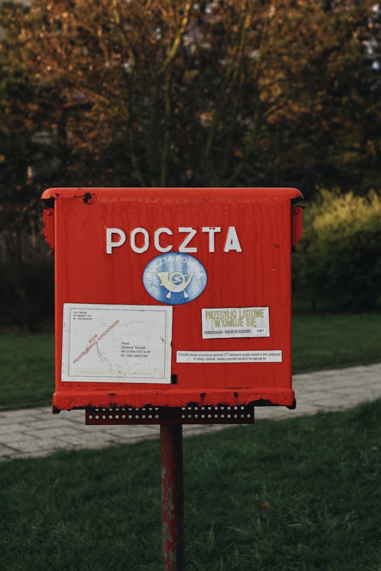 Close-up of a Polish mailbox in Zamosc, showcasing vibrant colors and outdoor setting.
