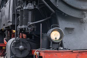 Close-up of a vintage locomotive engine and headlight in Sonneberg, Germany.